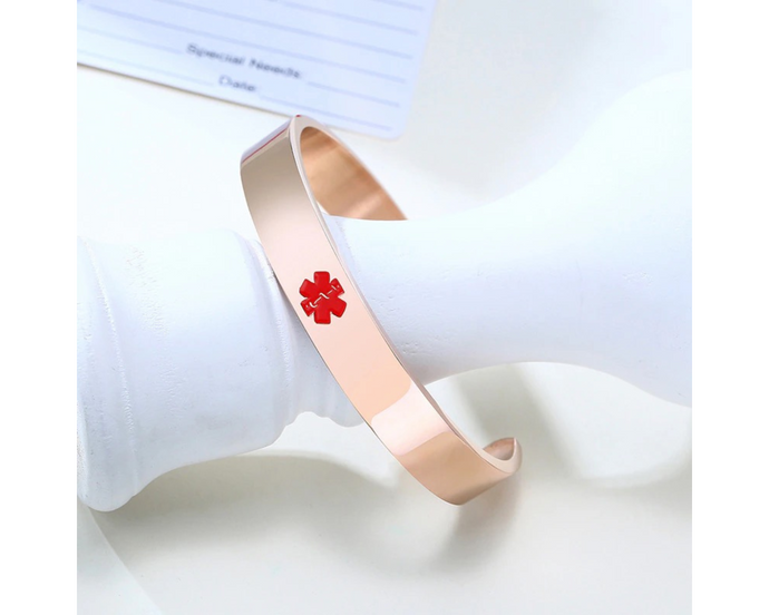 Rose gold stainless steel medical alert bangle bracelet.