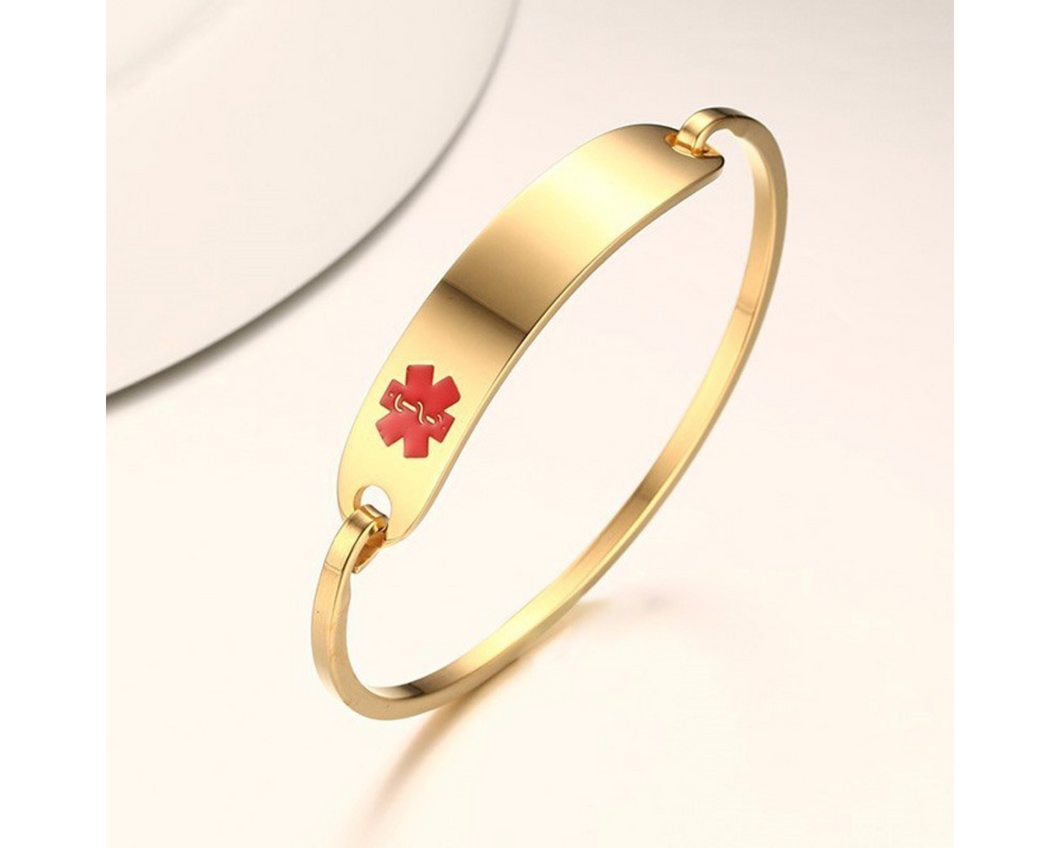 Gold medical alert bangle bracelet.